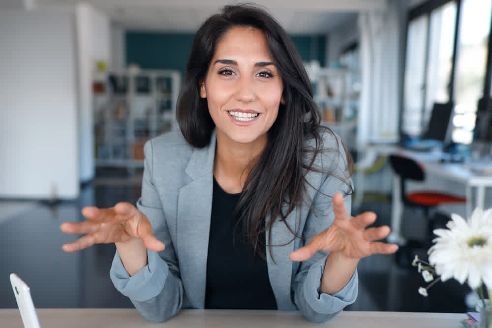 HR Manager creating onboarding video talking to camera- Top 5 Video Presentation Ideas for your Business - Clipchamp Blog